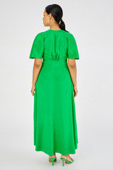 Profile view of model wearing the Oroton Cape Sleeve Dress in Jewel Green and 93% silk 7% spandex for Women