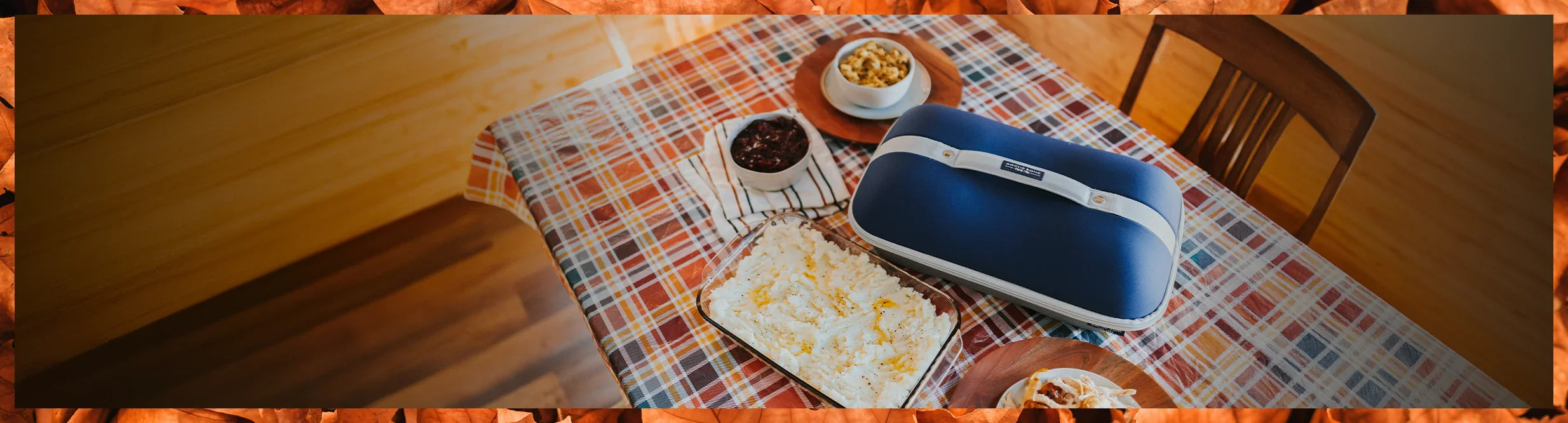 Arctic Zone Food Pro Casserole Carrier on a table set for Thanksgiving.