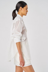 Profile view of model wearing the Oroton Lace Flower Sheer Overshirt in Antique White and 100% Cotton for Women