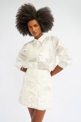 Profile view of model wearing the Oroton Lace Flower Sheer Overshirt in Antique White and 100% Cotton for Women